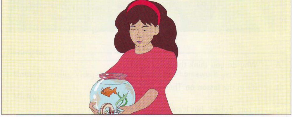 A girl holding a goldfish bowl